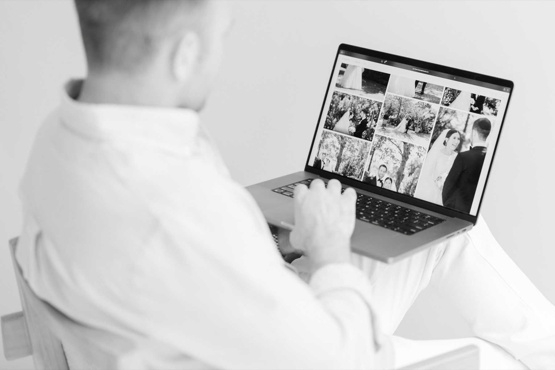 Alex reviewing a wedding gallery