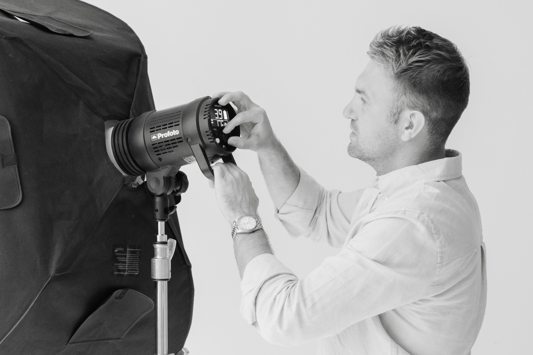 Alex adjusting studio lighting