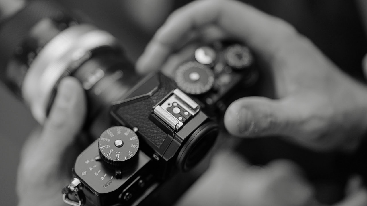 Camera in hand, close up