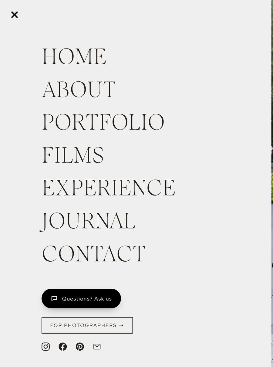 The site menu with a dark pill button reading Questions? Ask us beneath the navigation links